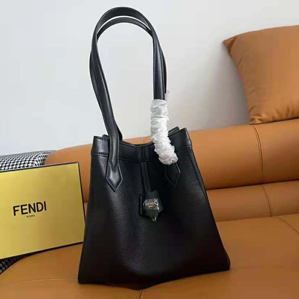 Close-up of black leather and gold-tone hardware on Fendi origami bag