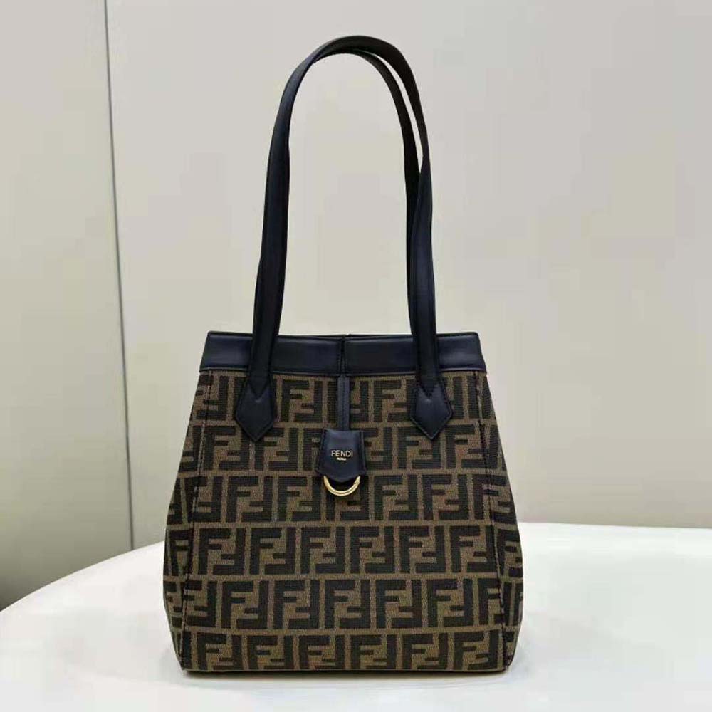 Close-up of gold-tone hardware on Fendi Women Origami Medium Brown Bag
