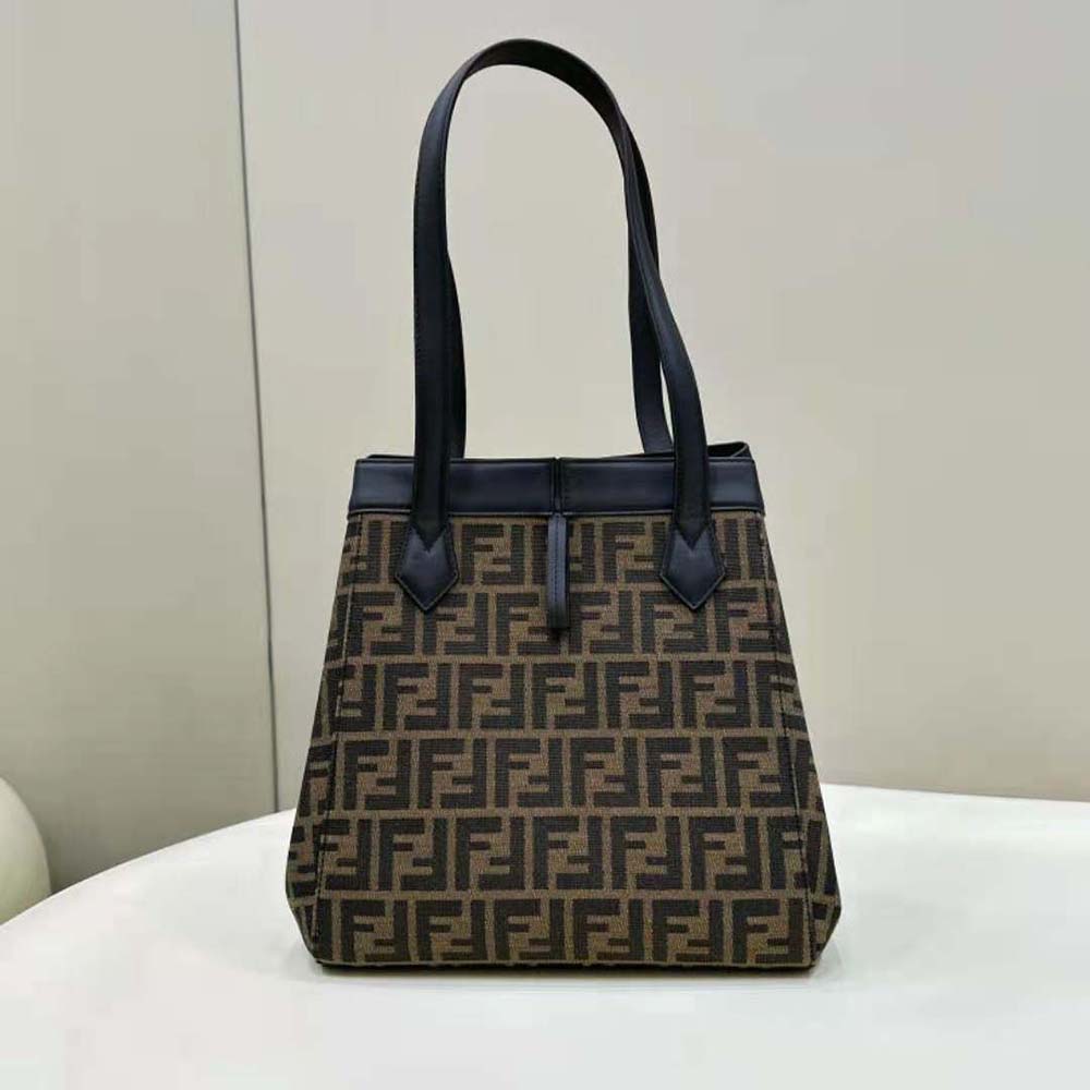 Side angle showing foldable silhouette of Fendi Women Origami Medium Brown Bag