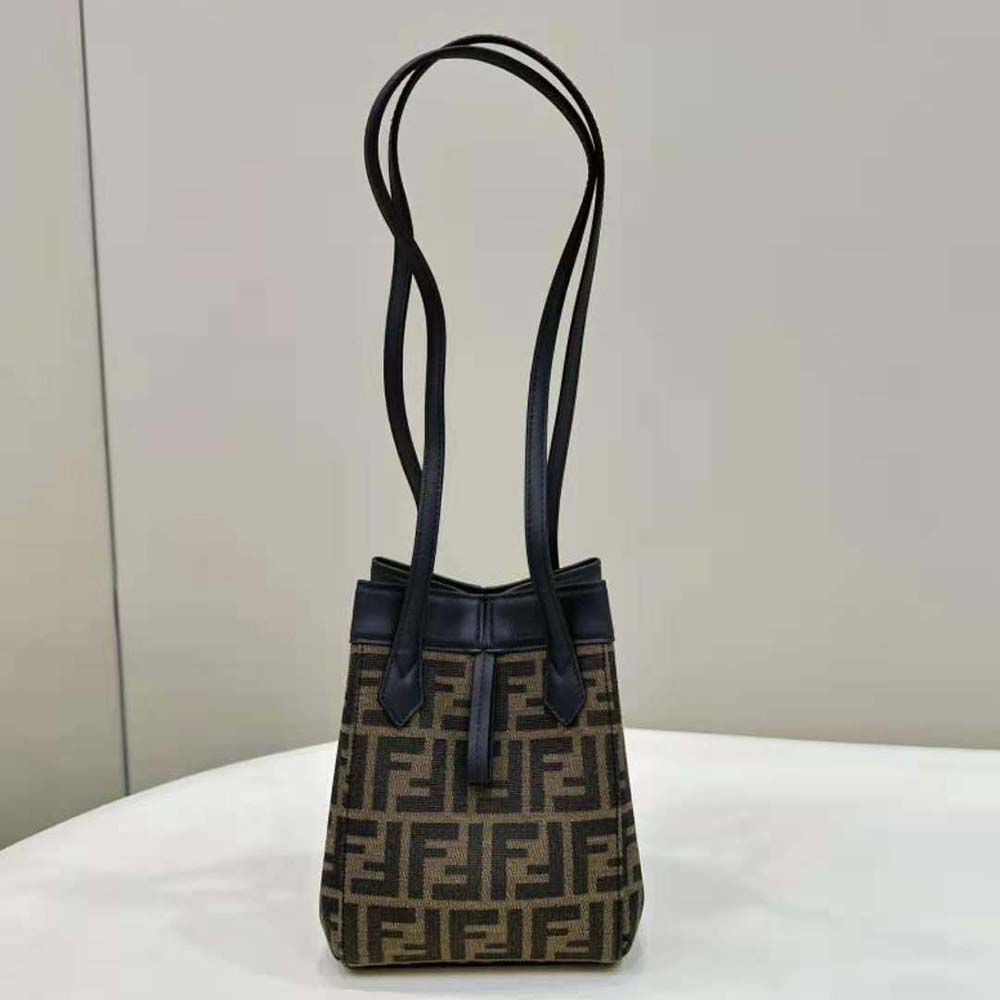 Side angle showing the transformable origami silhouette of Fendi mini bag
