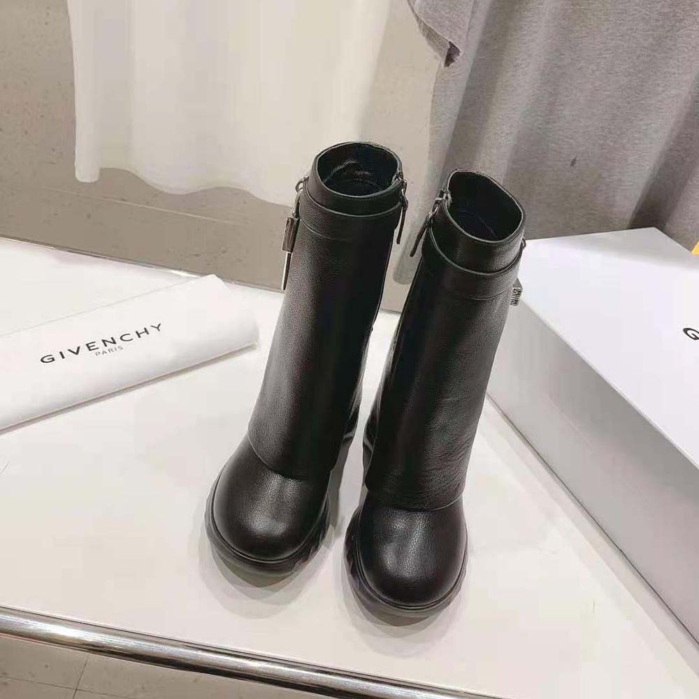 Close-up on Shark Lock silver hardware detail on Givenchy biker boots