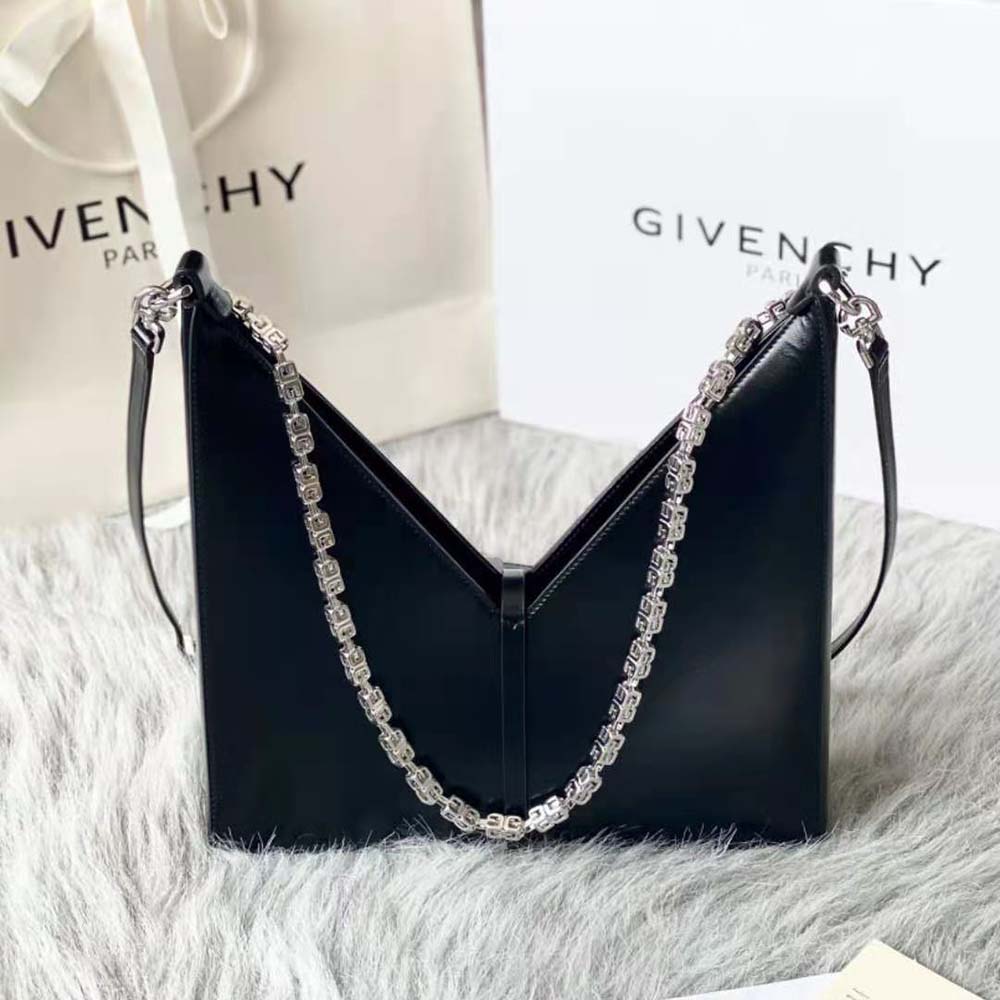 Side angle showing compact silhouette and black box leather texture
