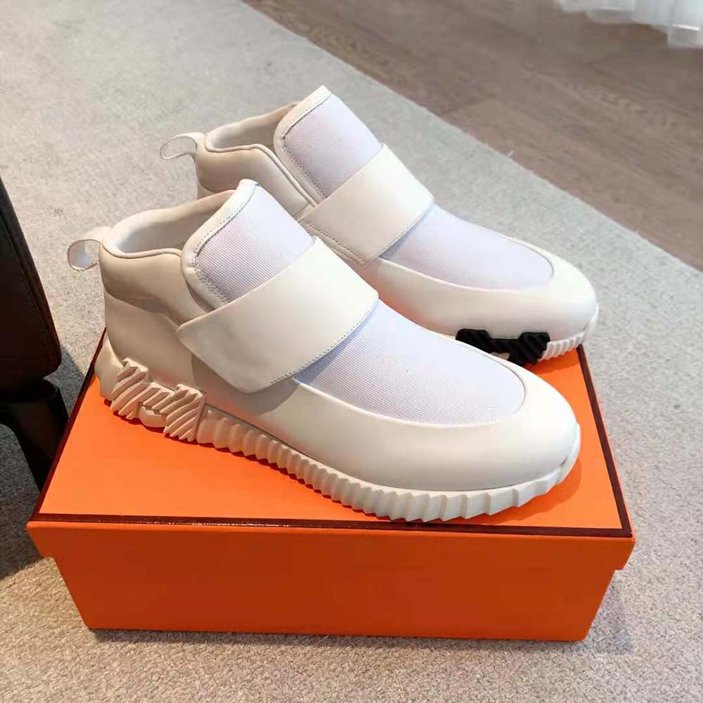 Top angle showing stretch canvas and calfskin details on Hermes Men H Sneaker