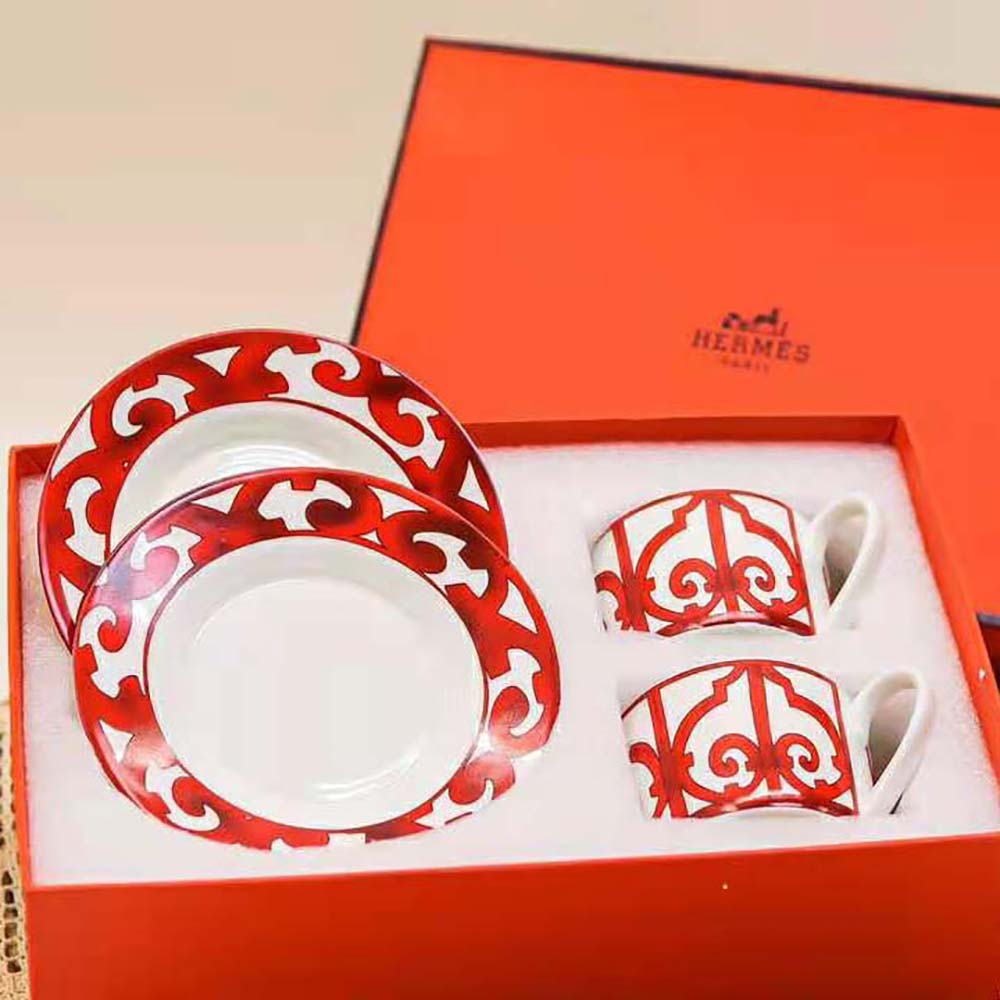 Close-up on red porcelain and detailed pattern of Hermes tea cup
