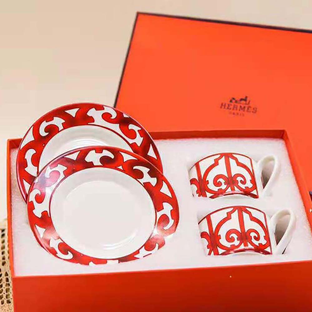 Top angle showing saucer and tea cup with Hermes signature design