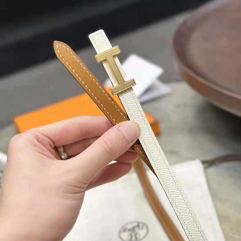 Close-up of gold buckle on Hermes Women Focus Belt Buckle & Reversible Leather Strap