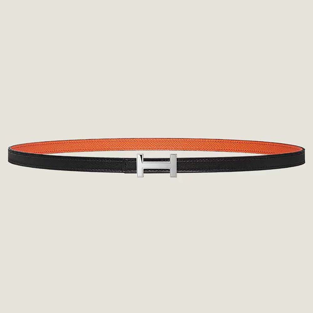 Close-up of Hermes Women Focus Belt Buckle silver clasp and orange leather