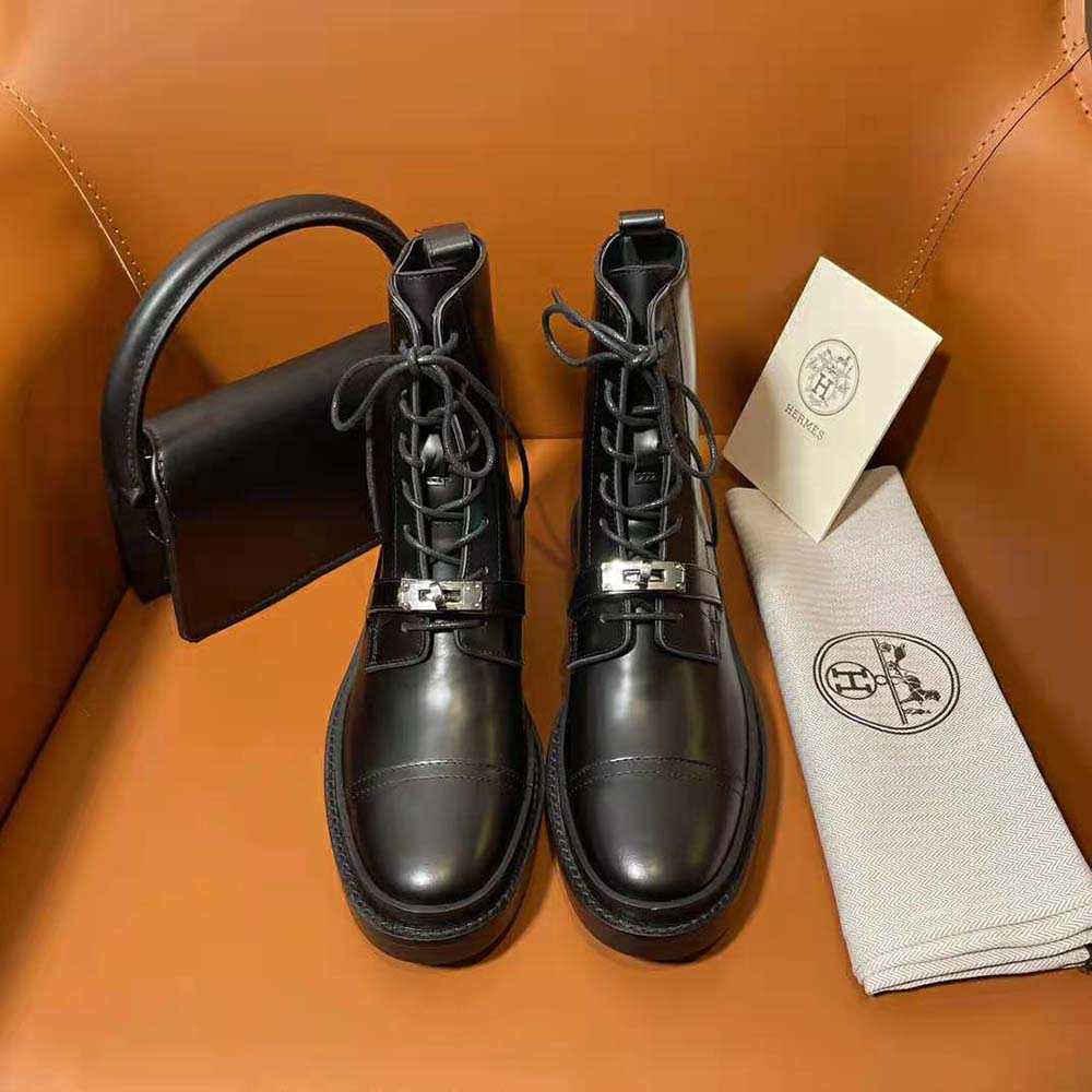 Close-up on signature Hermes hardware on Funk Ankle Boot black leather