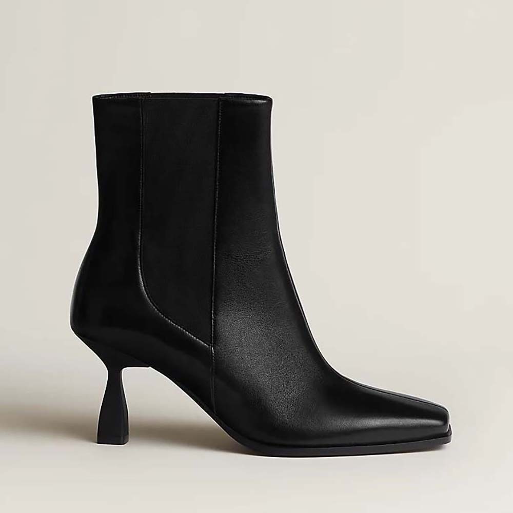 Side profile of Hermes Women Gill 75 Ankle Boot-Black showcasing smooth leather