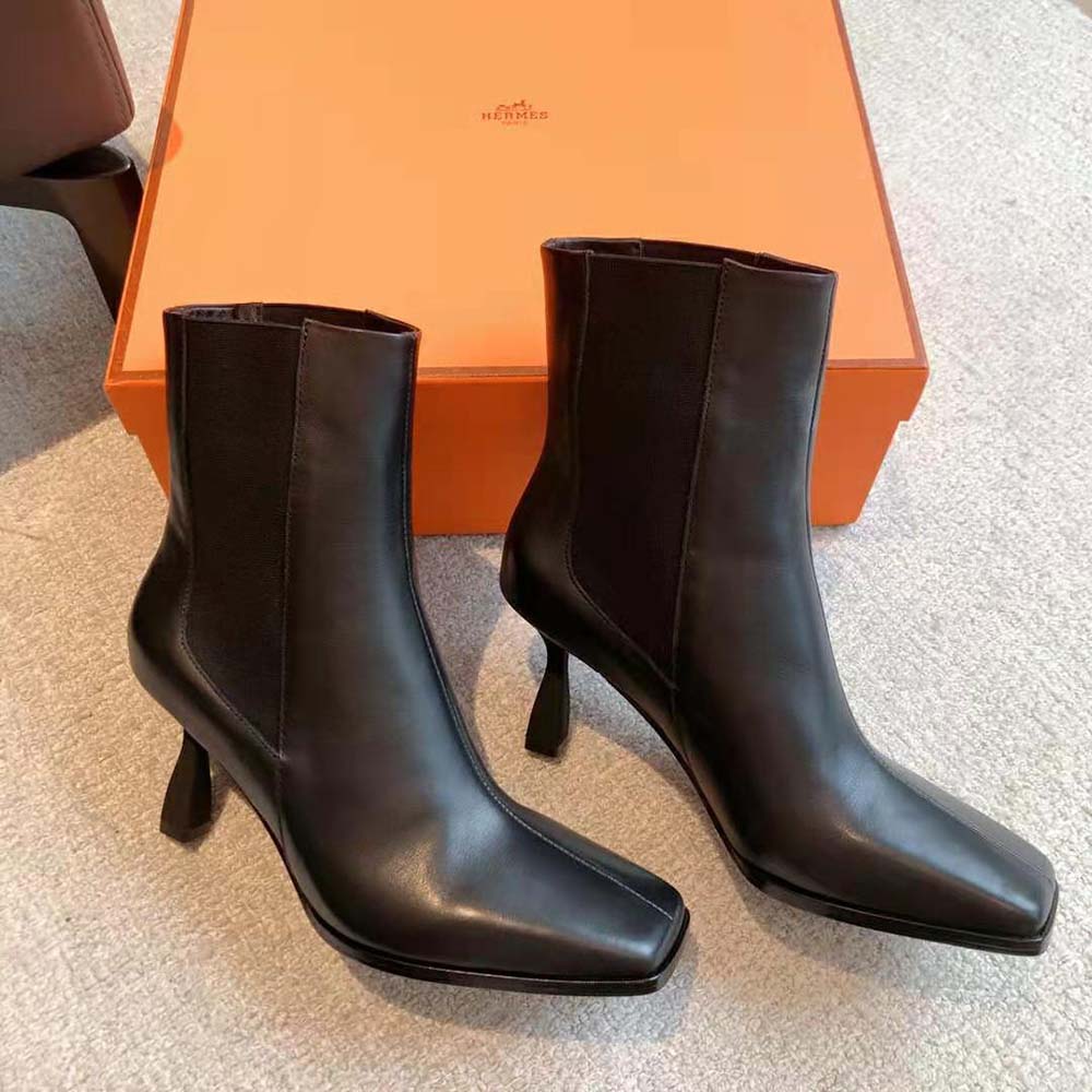 Front angle view of Hermes Women Gill 75 Ankle Boot-Black highlighting silhouette