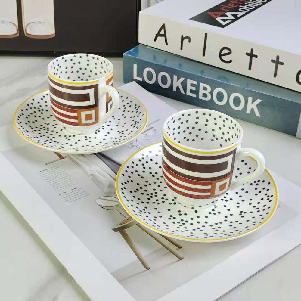 Side angle showing the smooth glossy finish of Hermes Hippomobile cup and saucer