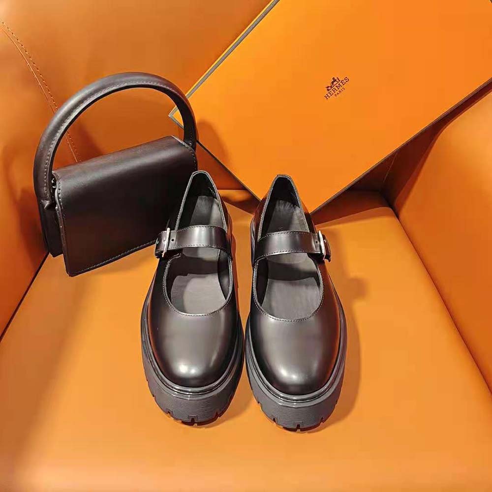 Close-up of black calfskin leather and signature Hermes logo detail