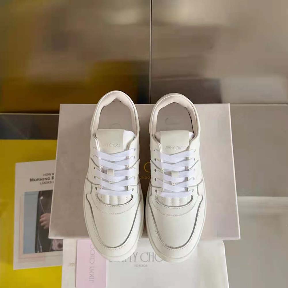 Close-up on lace and Jimmy Choo logo hardware on Florent/F trainers