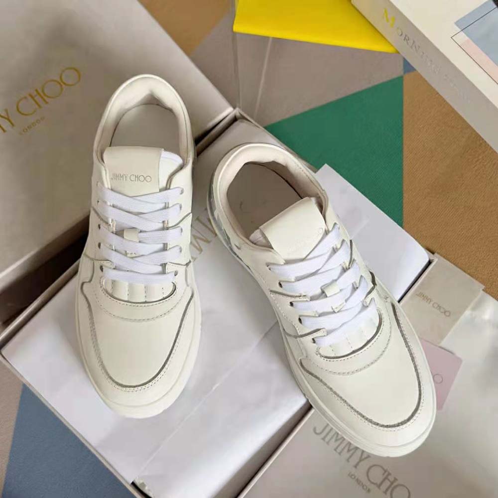 Top-down view highlighting peacock leather mix details on Jimmy Choo trainers