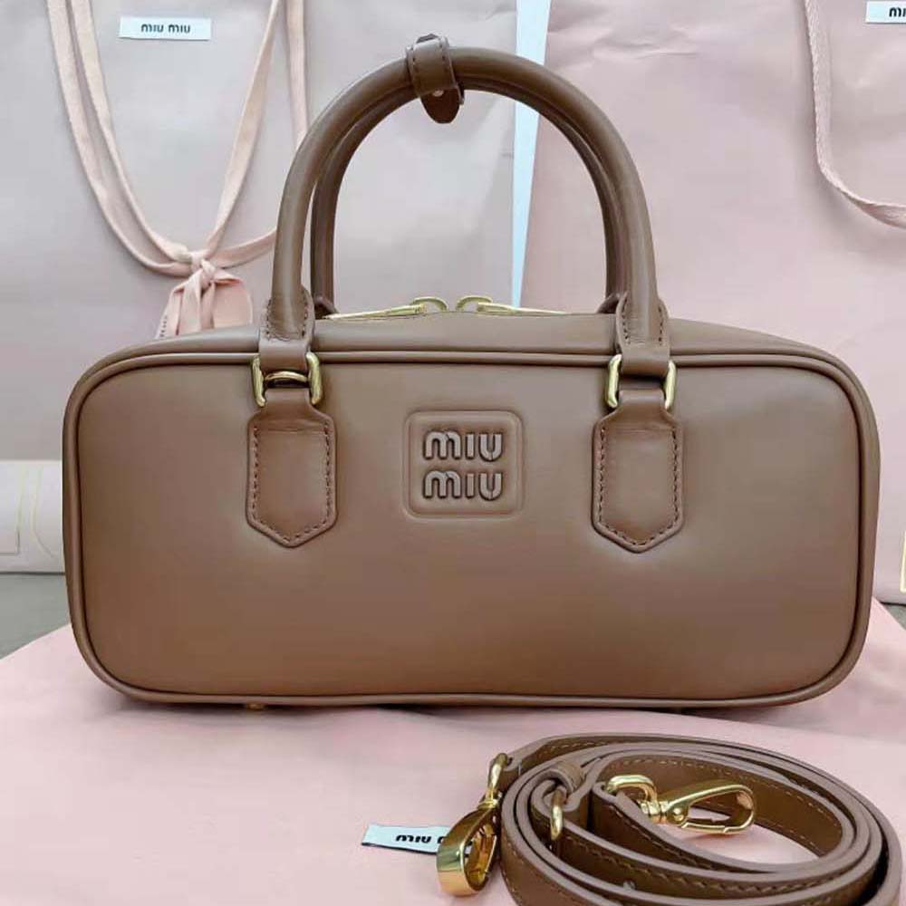 Close-up of silver-tone hardware on Miu Miu Women Arcadie Leather Bag-Brown
