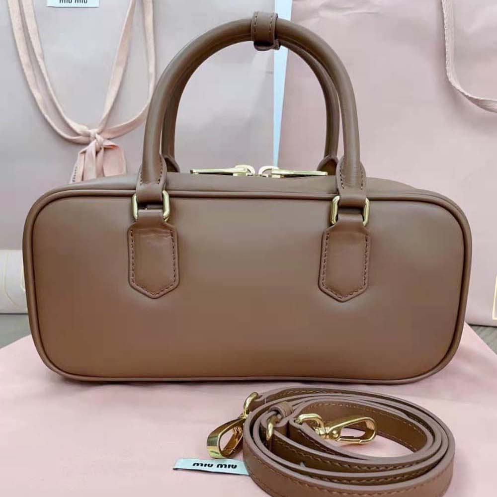Side angle highlighting smooth brown leather texture on Miu Miu Women Arcadie Leather Bag-Brown