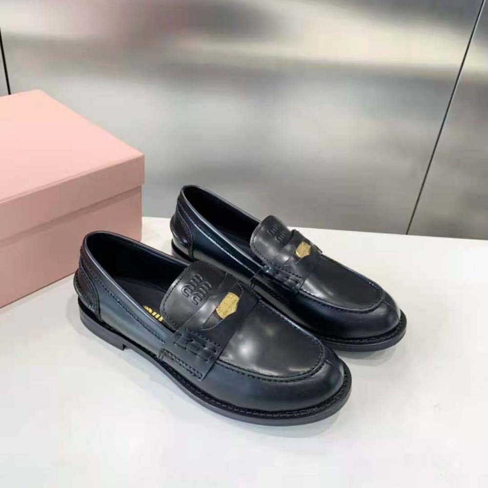 Top-down view highlighting silver hardware on Miu Miu Women Brushed Leather Loafers-Black