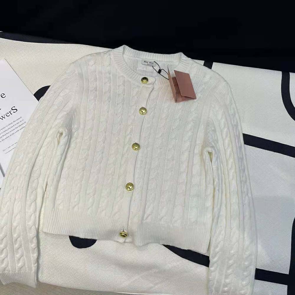 Side angle showing relaxed fit of Miu Miu Women Cashmere Cardigan white sweater