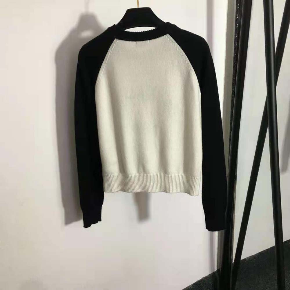 Side angle showing relaxed fit of Miu Miu Women Cashmere Crew-neck Sweater