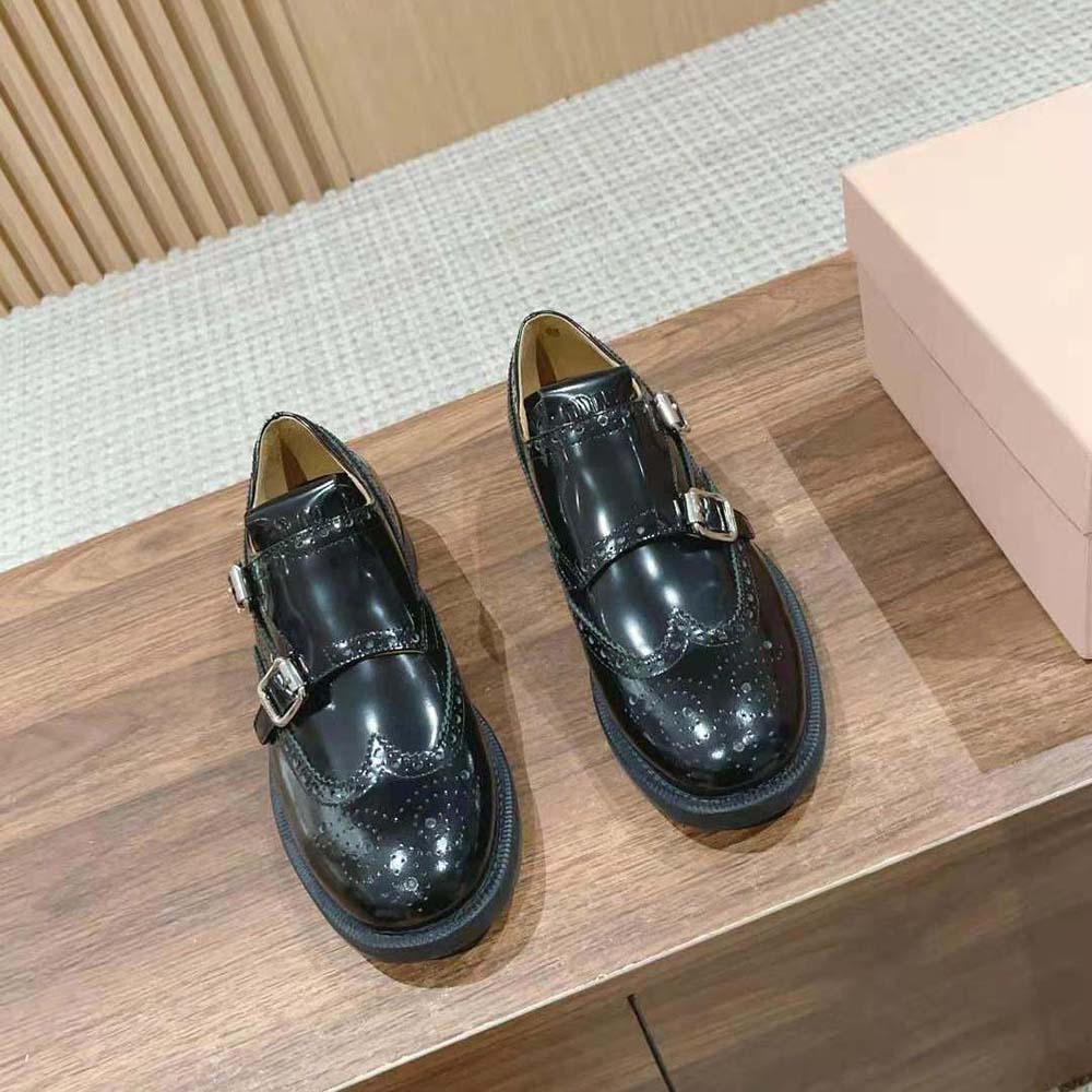Close-up of double monk straps and metal buckles on Miu Miu brogue shoes