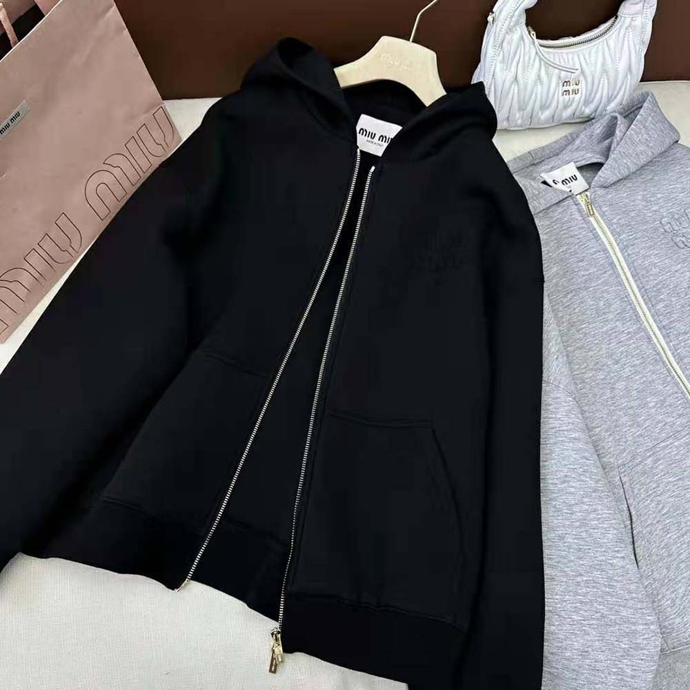 Side profile showing fit and fabric texture of Miu Miu Women Cotton Hoodie