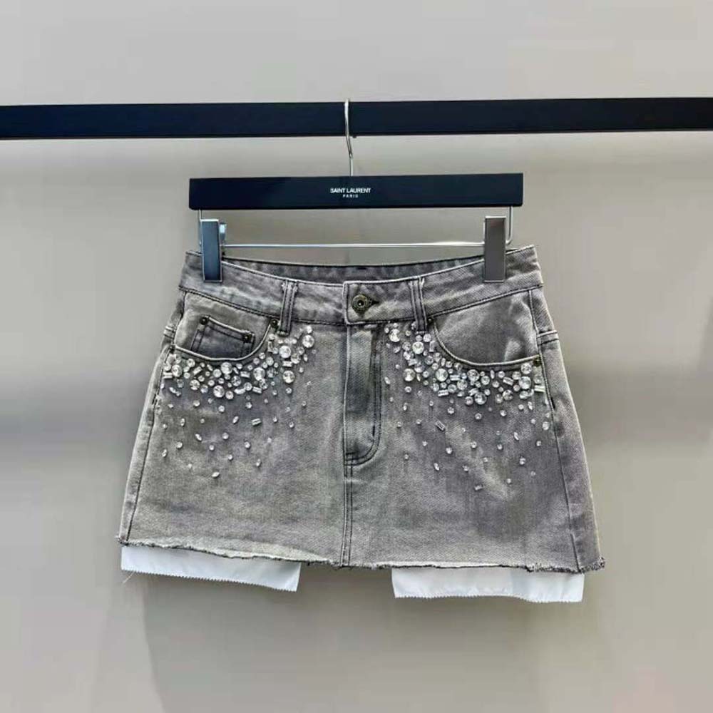 Close-up on embroidered logo detail of Miu Miu Women Denim Miniskirt