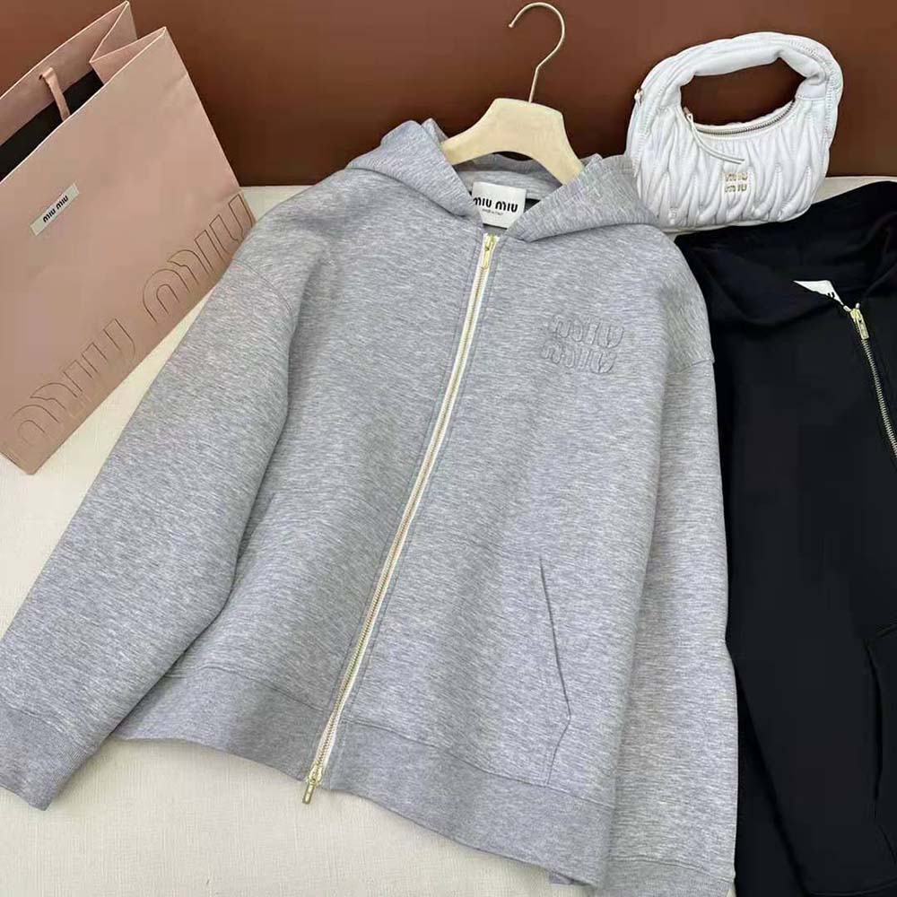 Side angle showing zip closure on Miu Miu silver fleece hoodie