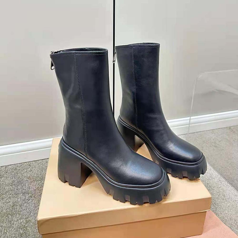 Top view showing sleek silhouette of Miu Miu Women Leather Booties Black