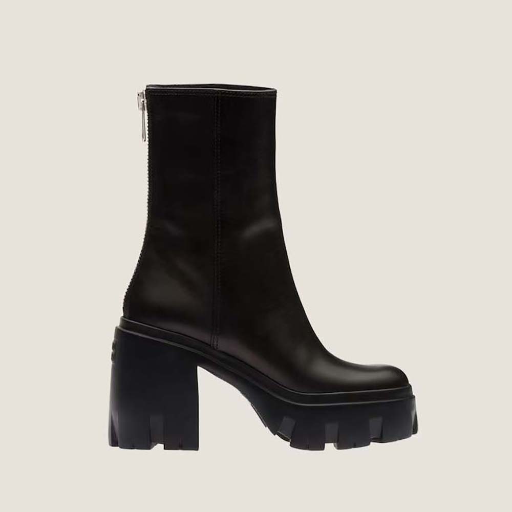 Side view of Miu Miu Women Leather Booties with EVA Sole with Logo in black