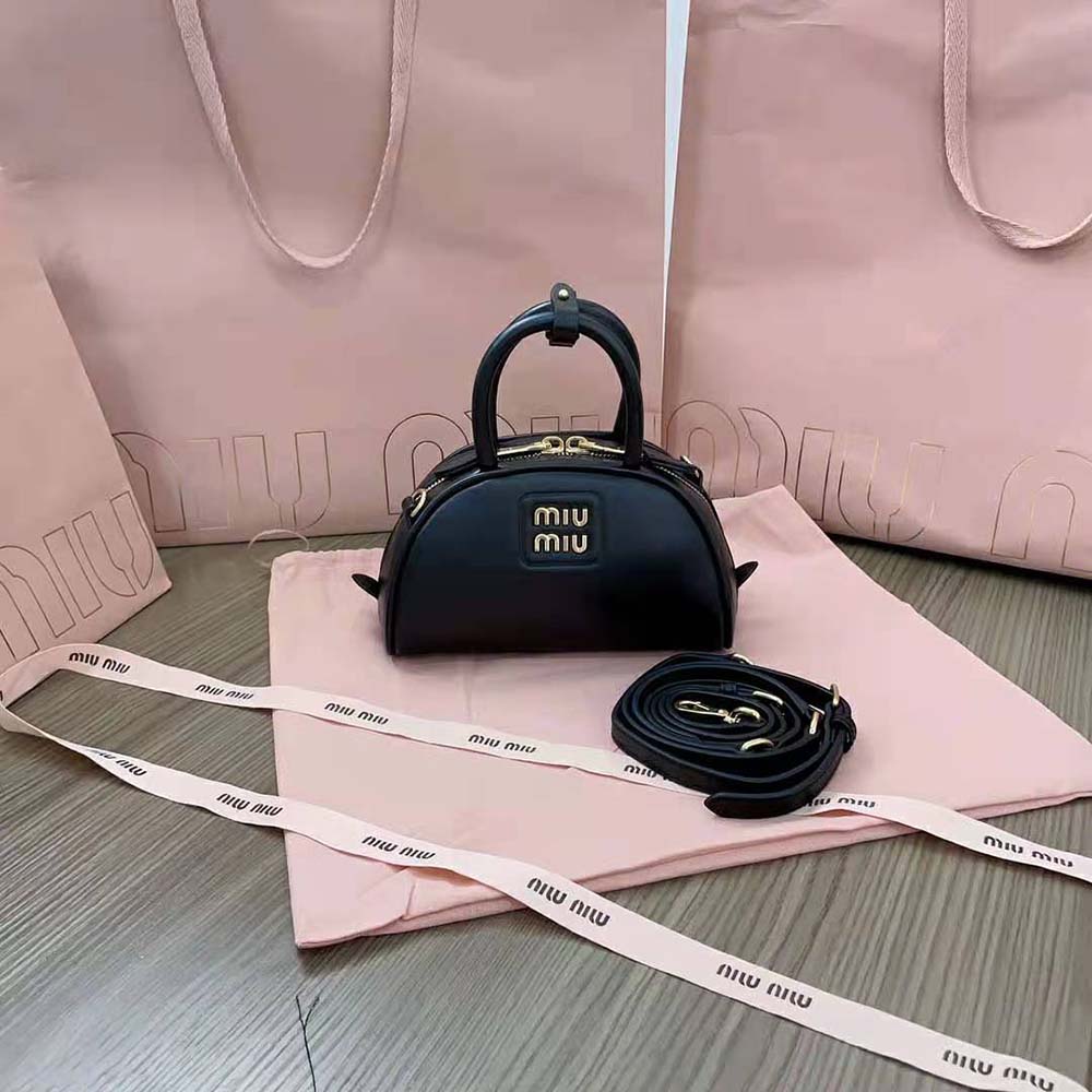 Close-up of silver-tone hardware on Miu Miu Women Mini Leather Top-handle Bag-Black