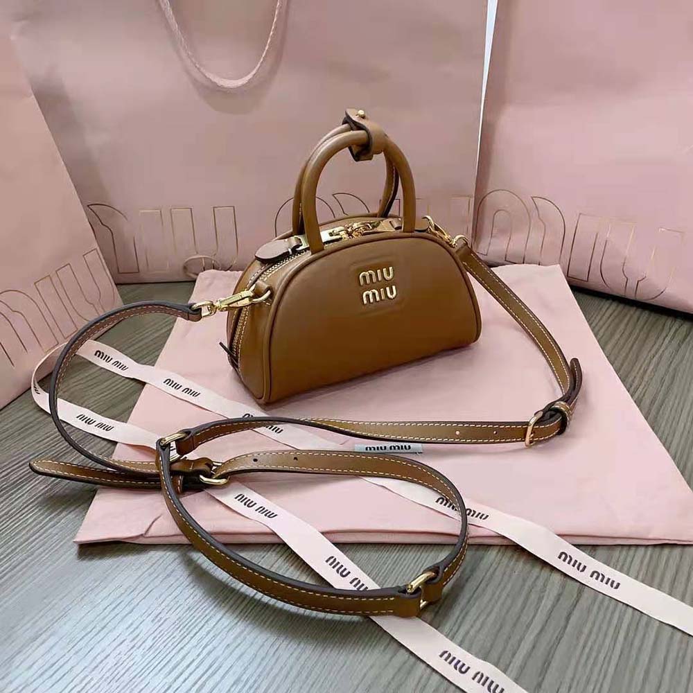Side angle showing slim profile of Miu Miu Women Mini Leather Top-handle Bag-Brown