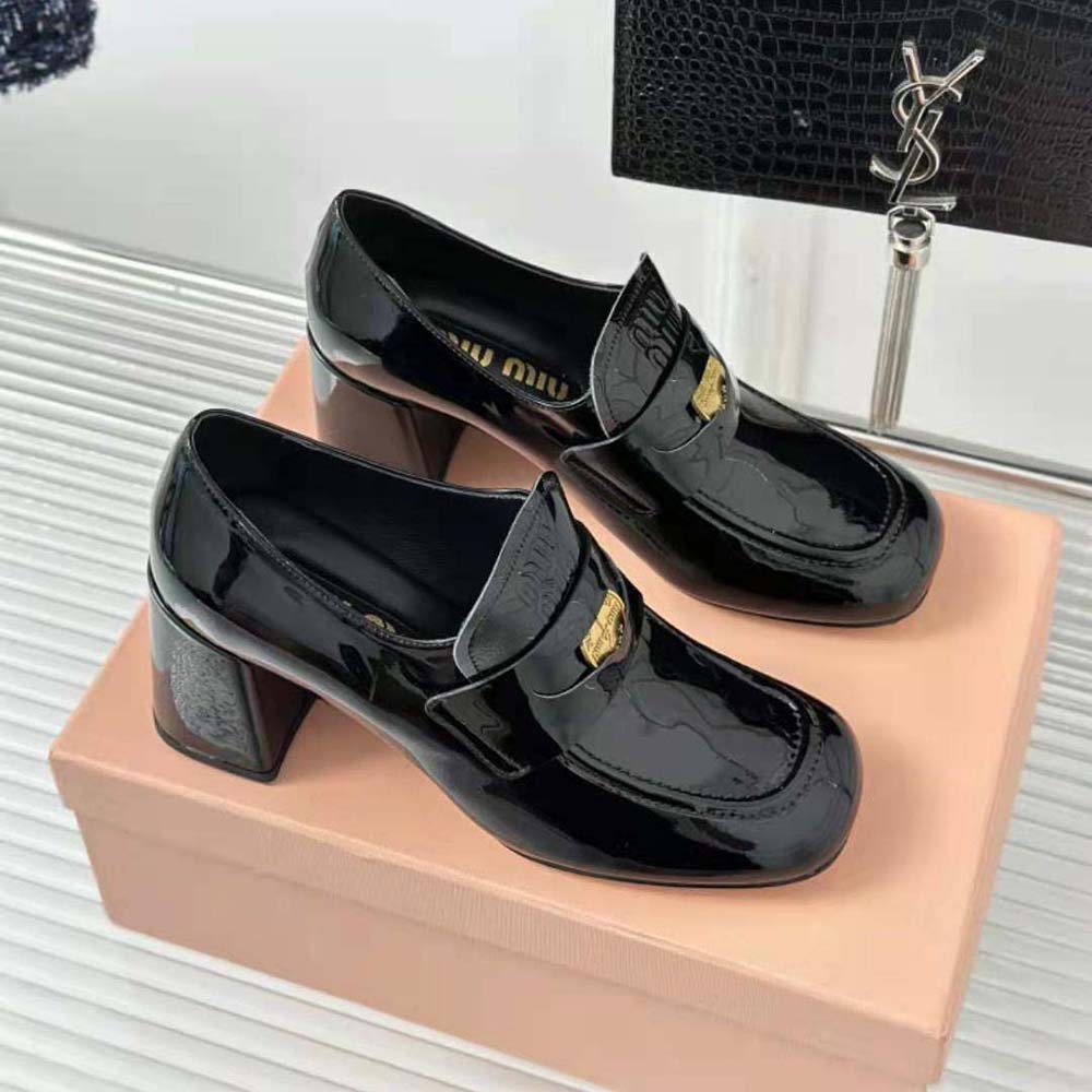 Overhead view of sleek black Miu Miu Women Patent Leather Loafers