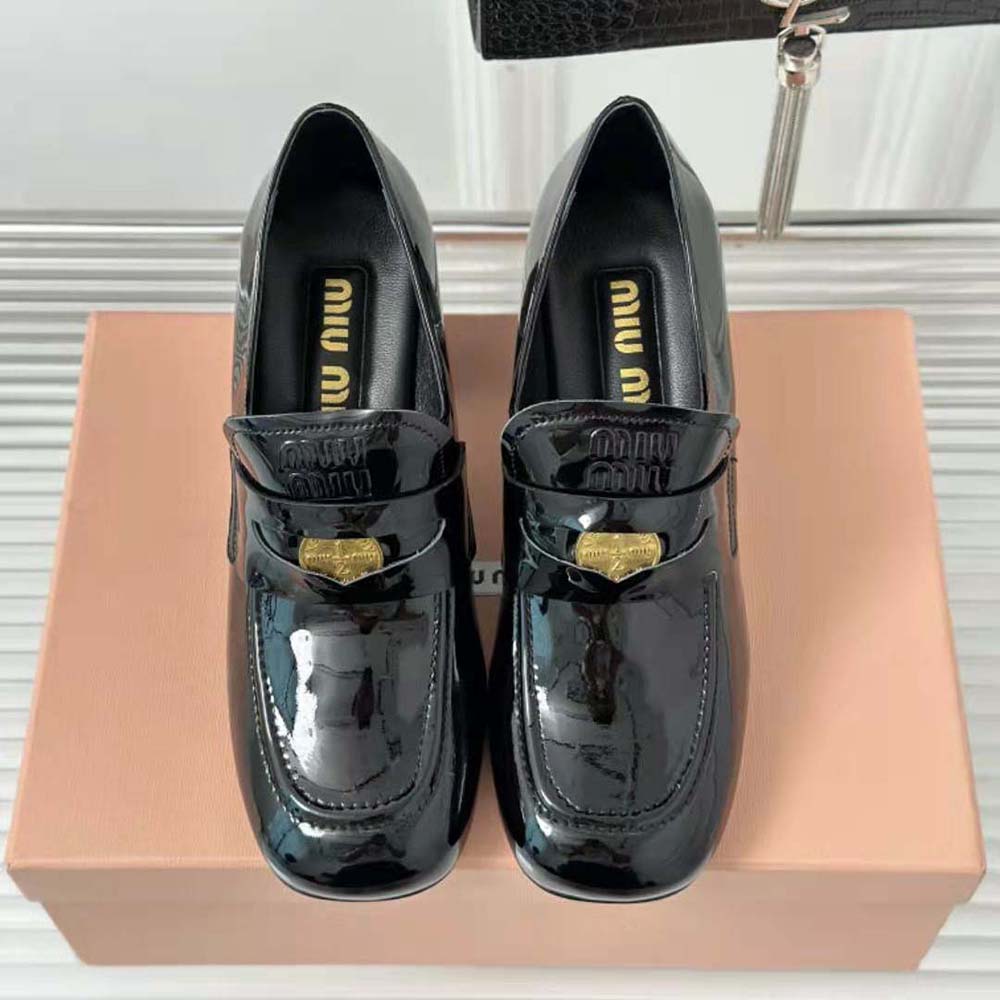Close-up of embossed logo on tongue of Miu Miu Women Patent Leather Loafers