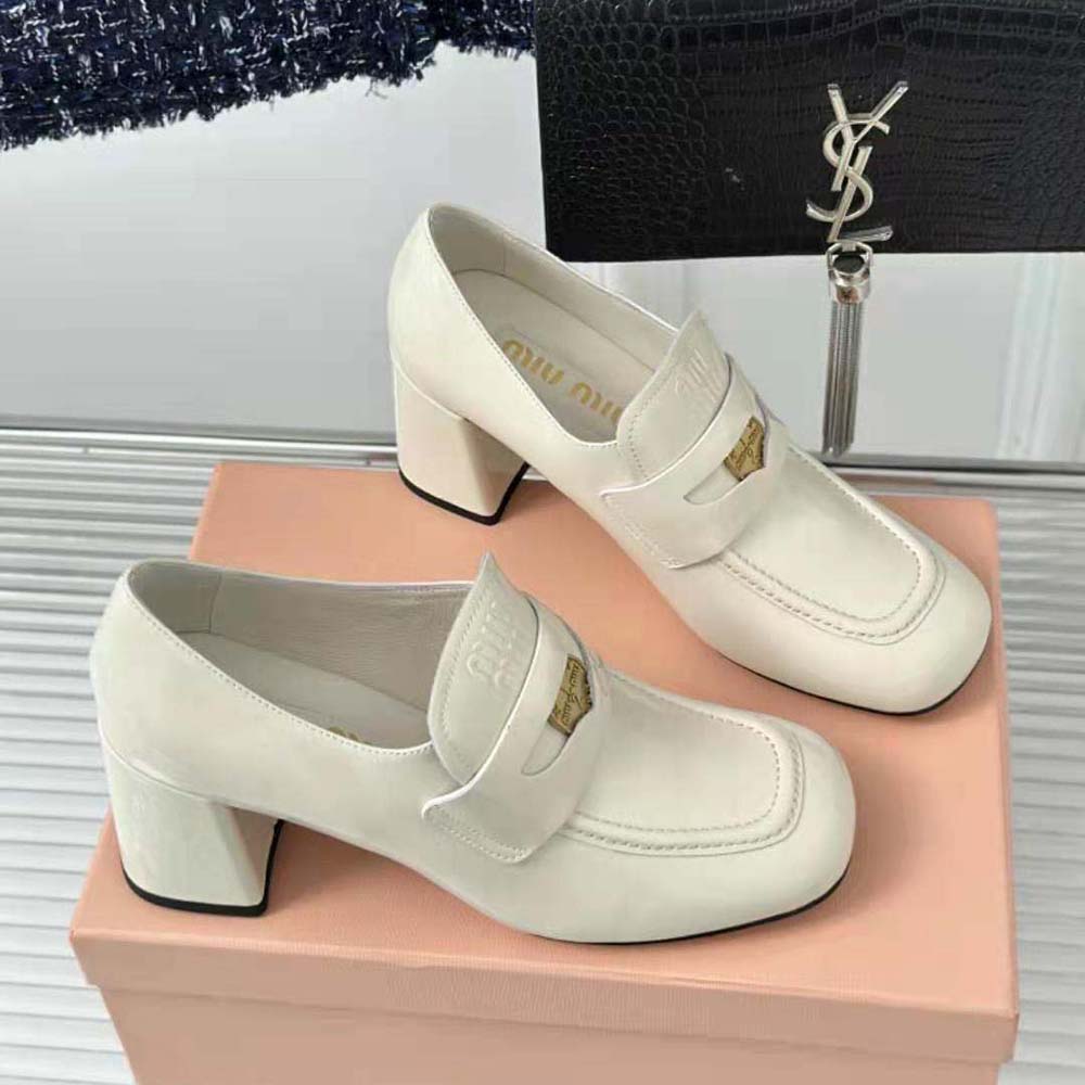Top view showcasing sleek silhouette of Miu Miu Women Patent Leather Loafers in white