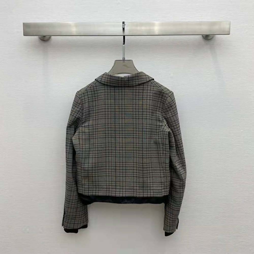 Side angle showing tailored silhouette of Miu Miu Brown Check Jacket