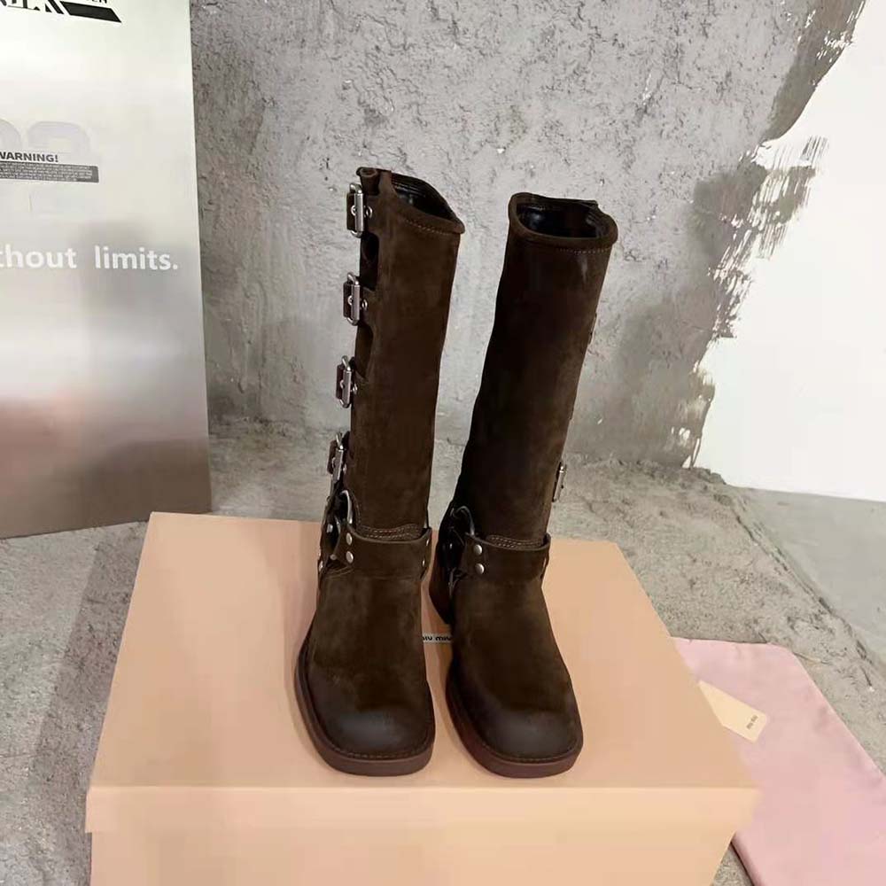 Close-up on metal harness ring detail of Miu Miu Women Suede Boots