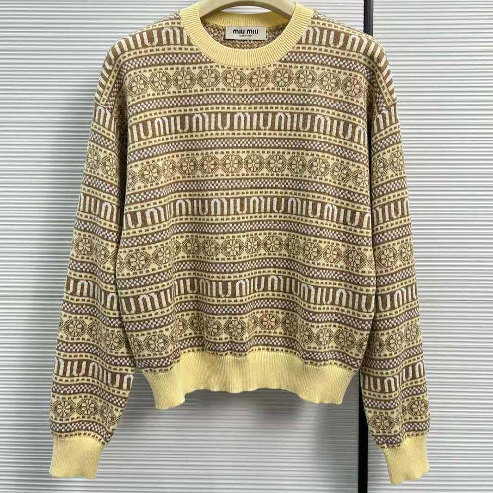 Close-up of jacquard logo detail on Miu Miu yellow wool sweater