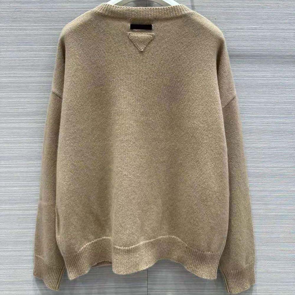 Detail of Prada logo on brown wool and cashmere sweater