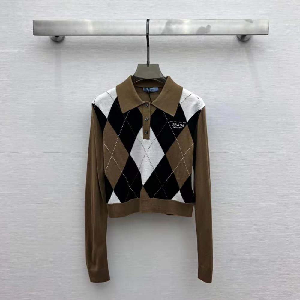 Close-up of collar and subtle Prada logo on cashmere polo shirt