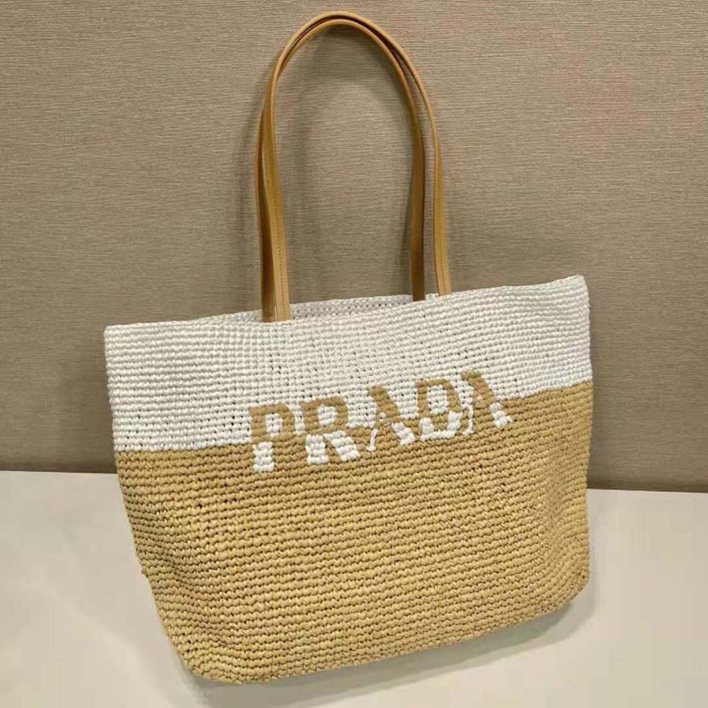 Close-up of leather trim and gold hardware on Prada Women Crochet and Leather Tote Bag