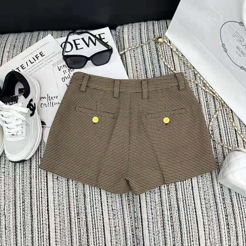 Side angle showing tailored silhouette of Prada Women Houndstooth Check Shorts