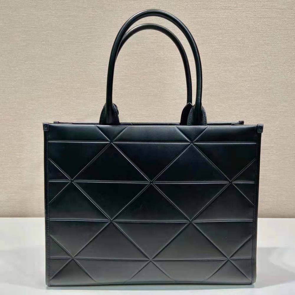 Side angle showing silver hardware and flap closure on Prada Women Large Leather Prada Symbole Bag with Topstitching
