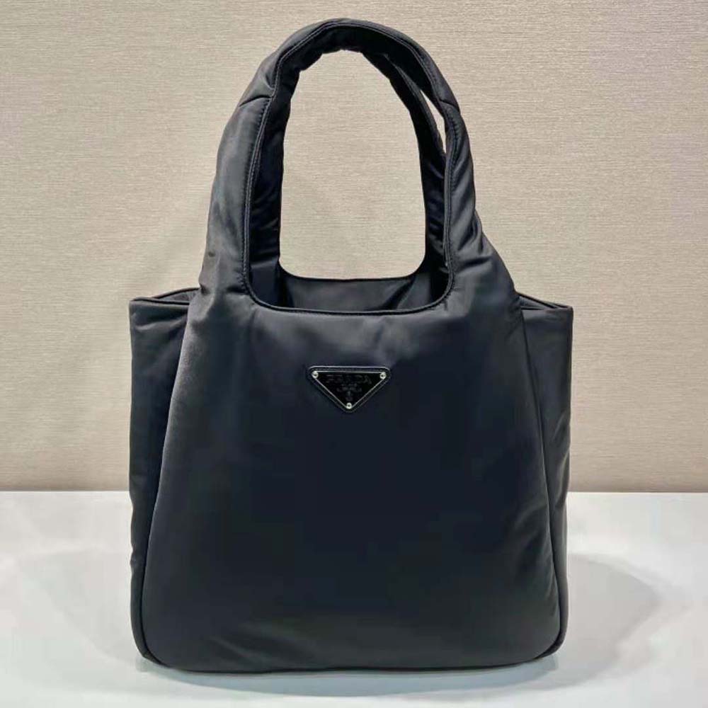 Close-up of padded Re-Nylon texture and Prada hardware on tote