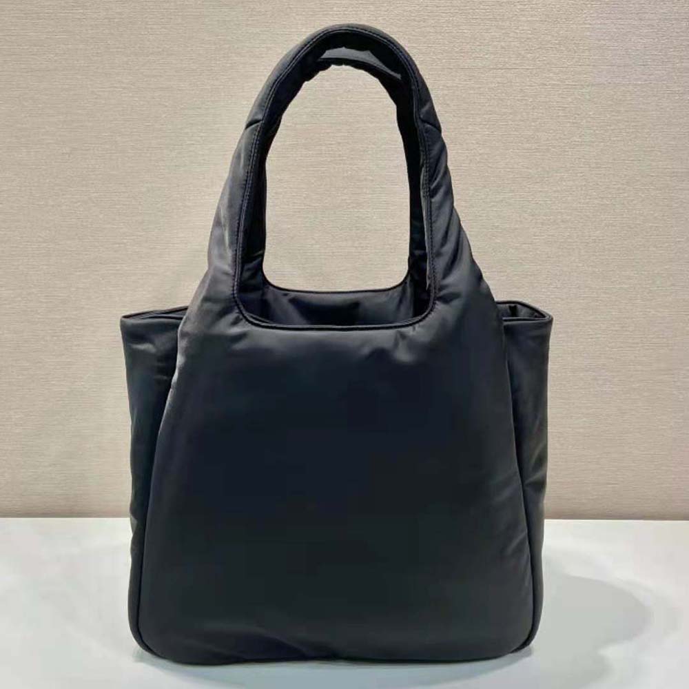 Side angle showing spacious interior of Prada Women Large Padded Re-Nylon Tote Bag-Black
