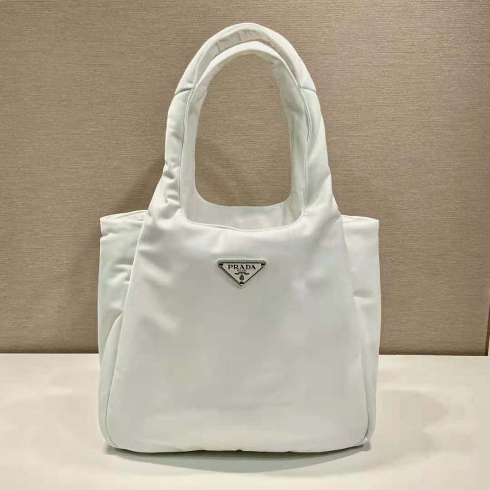 Side angle showing spacious interior and padded texture of Prada tote bag