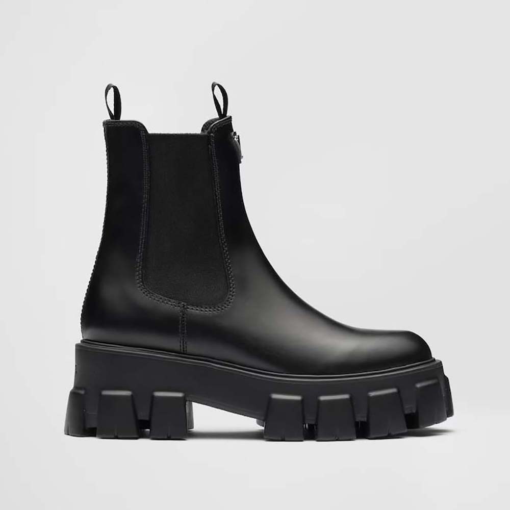 Side view of Prada Women Monolith Brushed Leather Booties-Black showcasing chunky sole