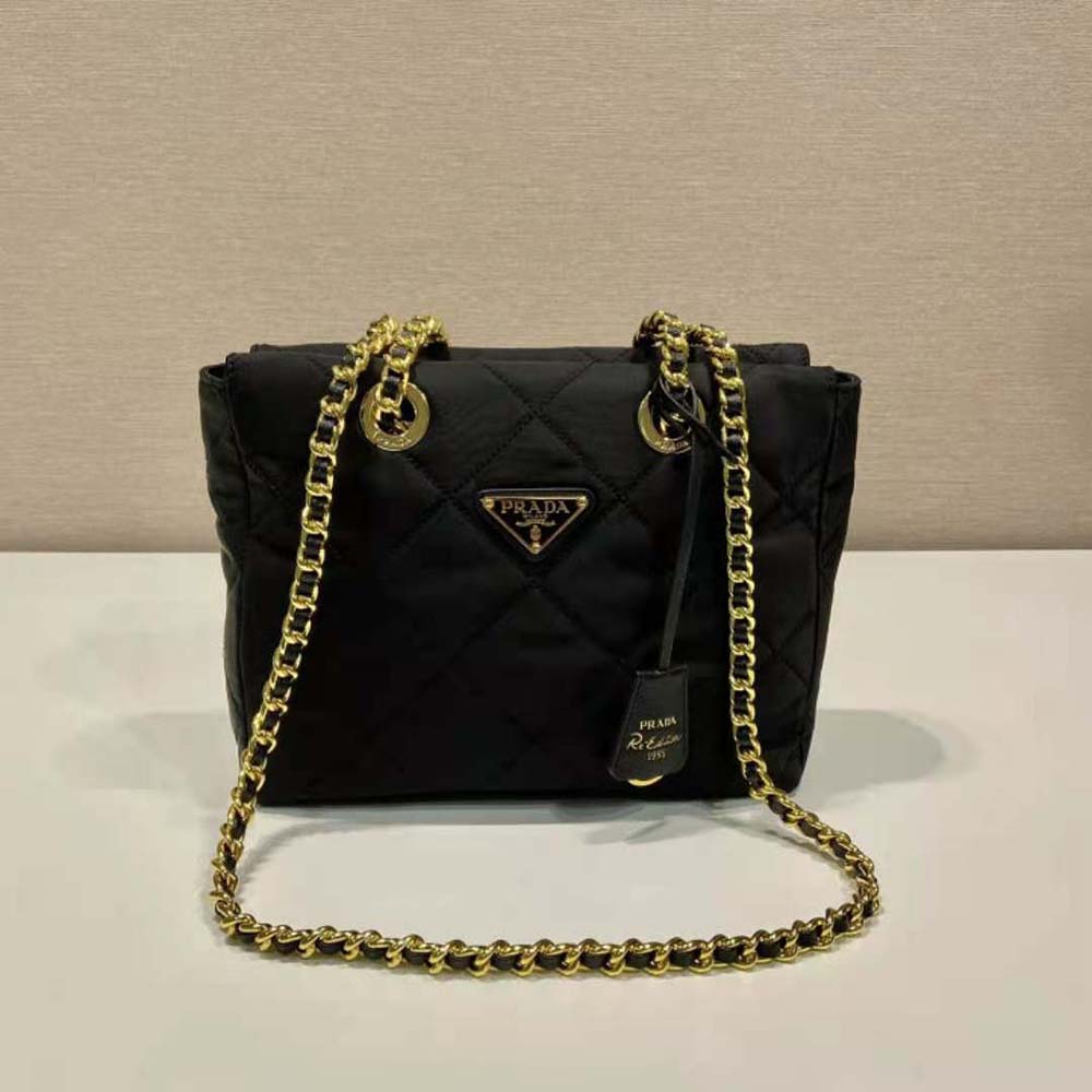 Close-up of silver-tone chain strap and black nylon fabric on Prada 1995 tote bag