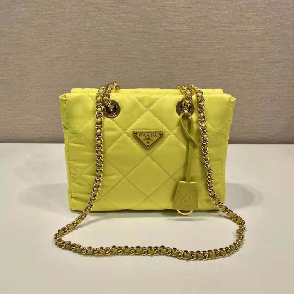 Side angle showing shape and zipper of Prada Women Re-Edition 1995 Tote Lime