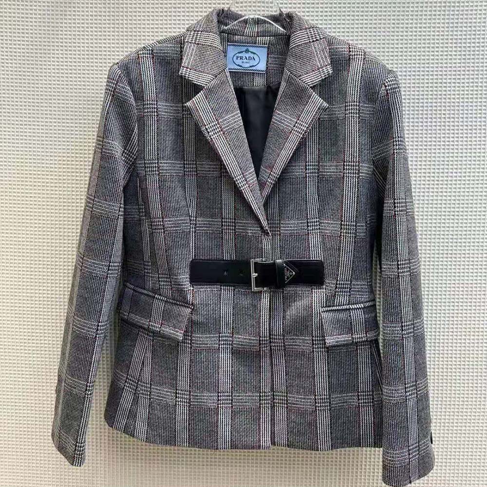 Close-up on metal branded buttons of Prada Women Single-breasted Prince of Wales Jacket