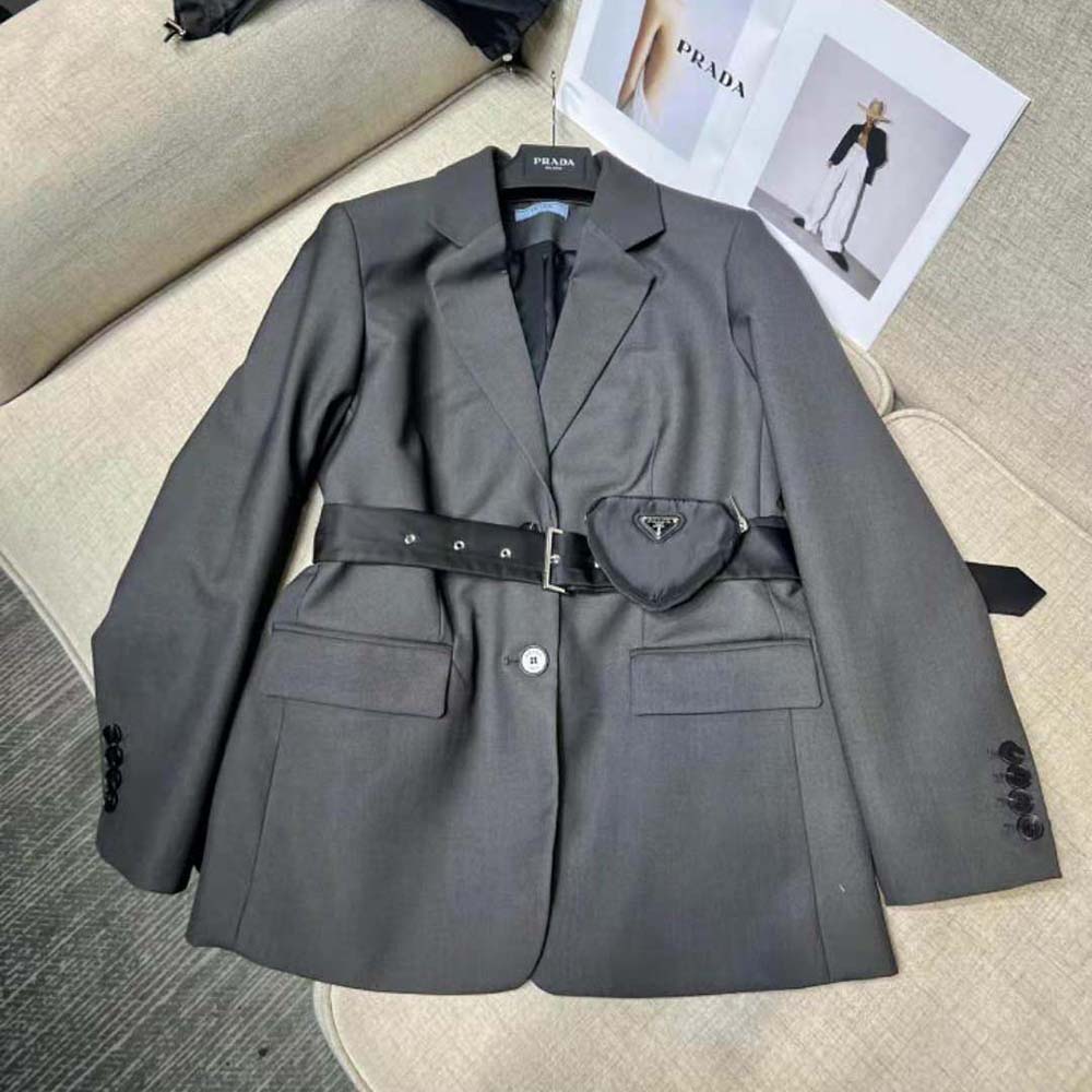 Close-up of Prada jacket’s signature hardware and fabric texture